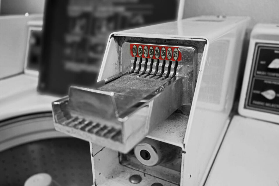 closeup of coin operated washing machine